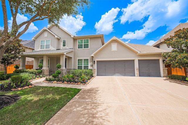 18806 Dove Creek Springs Trl, Cypress, TX 77433 - view of front facade featuring stucco siding, driveway, a garage, a standing seam roof, and a metal roof