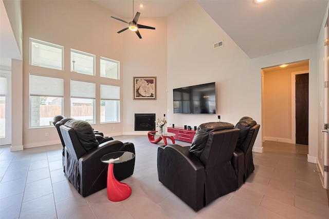 18806 Dove Creek Springs Trl, Cypress, TX 77433 - living room with high vaulted ceiling, ceiling fan, a fireplace, light tile patterned floors, and recessed lighting