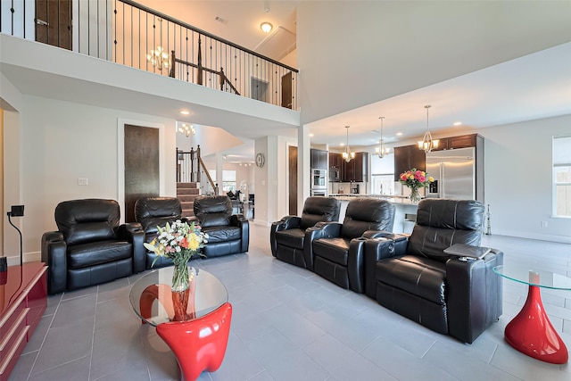 18806 Dove Creek Springs Trl, Cypress, TX 77433 - tiled living area featuring stairway, a towering ceiling, recessed lighting, and a chandelier