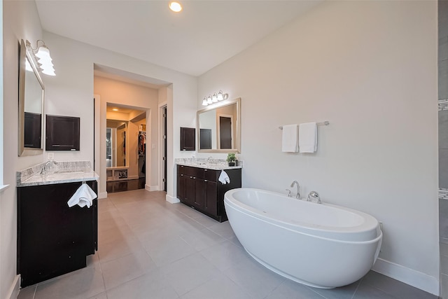 18806 Dove Creek Springs Trl, Cypress, TX 77433 - bathroom featuring tile patterned floors, a freestanding bath, and two vanities