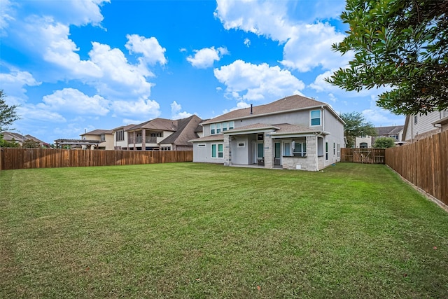 18806 Dove Creek Springs Trl, Cypress, TX 77433 - back of house featuring a fenced backyard and stone siding