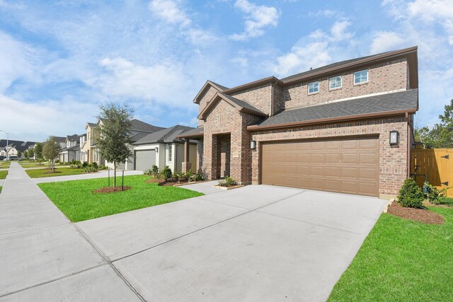 22006 Big Sky Dr, Tomball, TX 77375 - view of front facade with concrete driveway, brick siding, a residential view, and roof with shingles