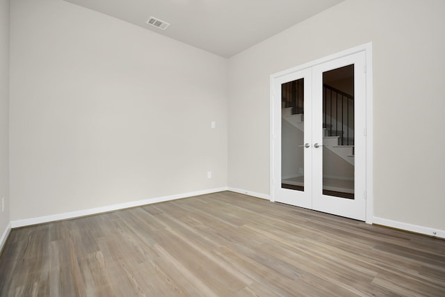 22006 Big Sky Dr, Tomball, TX 77375 - empty room featuring wood finished floors and french doors