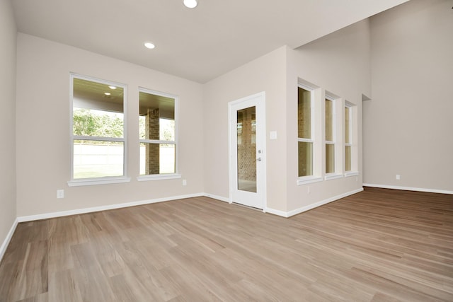 22006 Big Sky Dr, Tomball, TX 77375 - empty room with light wood-style flooring and recessed lighting