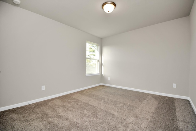 22006 Big Sky Dr, Tomball, TX 77375 - carpeted spare room featuring baseboards and a smoke detector
