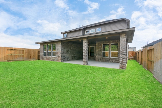 22006 Big Sky Dr, Tomball, TX 77375 - rear view of property featuring a patio, a fenced backyard, and brick siding