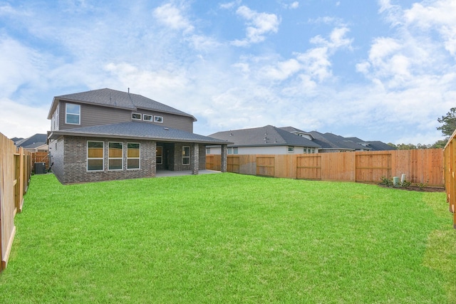 22006 Big Sky Dr, Tomball, TX 77375 - back of property with a patio, a fenced backyard, roof with shingles, and brick siding