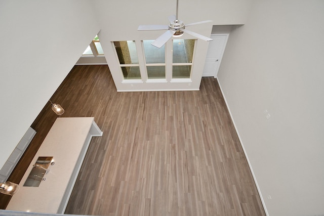 22006 Big Sky Dr, Tomball, TX 77375 - unfurnished living room with a ceiling fan and wood finished floors