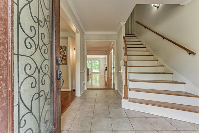 6103 Allentown Dr, Spring, TX 77389 - stairs featuring crown molding and tile patterned floors