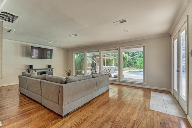 6103 Allentown Dr, Spring, TX 77389 - living room with ornamental molding, light wood-type flooring, plenty of natural light, and a fireplace