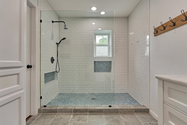 6103 Allentown Dr, Spring, TX 77389 - bathroom with tiled shower, vanity, recessed lighting, and tile patterned floors