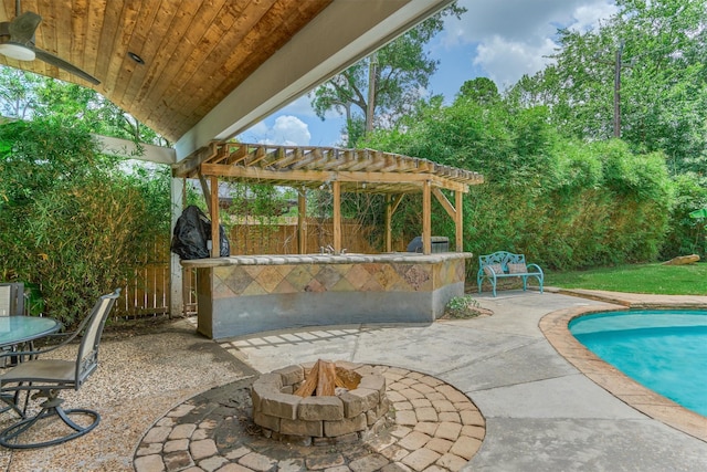 6103 Allentown Dr, Spring, TX 77389 - view of patio / terrace with a pergola, a fire pit, and an outdoor pool
