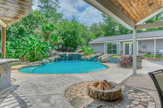 6103 Allentown Dr, Spring, TX 77389 - outdoor pool featuring french doors, a fire pit, and a patio area