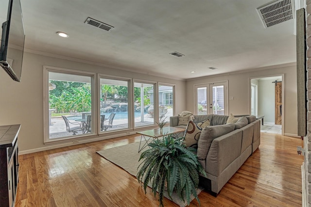 6103 Allentown Dr, Spring, TX 77389 - living area featuring ornamental molding, light wood-style floors, and recessed lighting