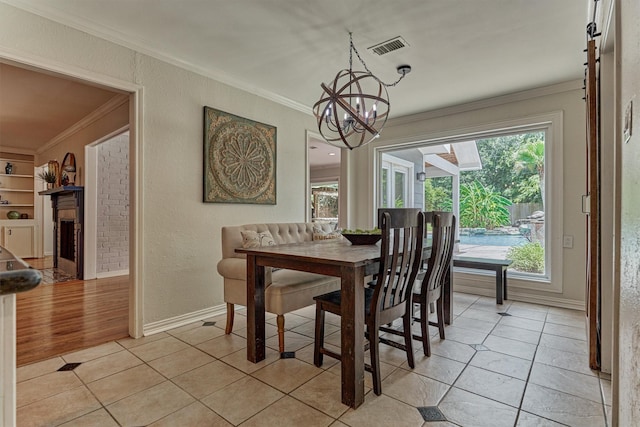6103 Allentown Dr, Spring, TX 77389 - dining space featuring ornamental molding, a chandelier, and light tile patterned flooring