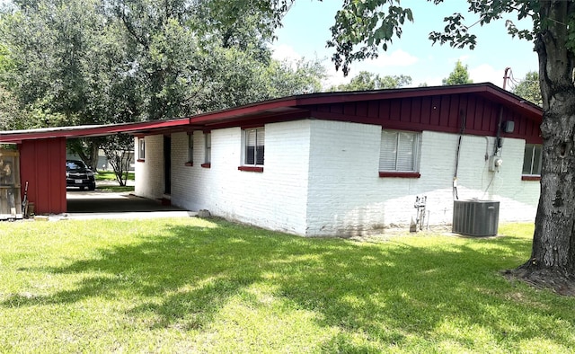 12332 Kayla Ln, Houston, TX 77015 - view of property exterior featuring brick siding, board and batten siding, and a carport