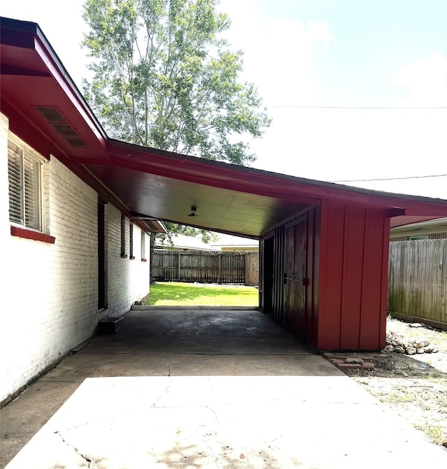 12332 Kayla Ln, Houston, TX 77015 - view of parking / parking lot featuring a carport and concrete driveway