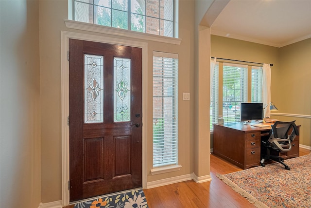 8812 Snowy Owl Loop, Missouri City, TX 77459 - foyer entrance featuring light wood-style flooring and crown molding