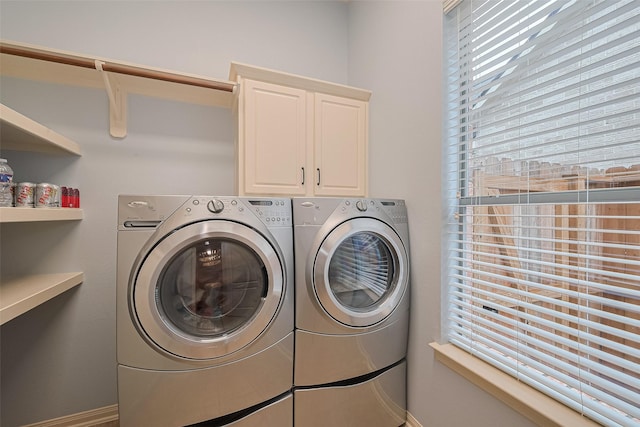 8812 Snowy Owl Loop, Missouri City, TX 77459 - laundry room with washer and dryer and cabinet space