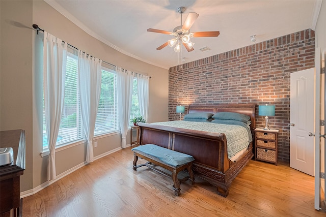 8812 Snowy Owl Loop, Missouri City, TX 77459 - bedroom featuring light wood-type flooring, brick wall, a ceiling fan, and ornamental molding