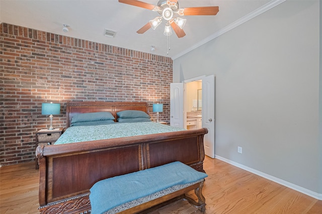 8812 Snowy Owl Loop, Missouri City, TX 77459 - bedroom with brick wall, light wood-style floors, crown molding, a ceiling fan, and ensuite bathroom