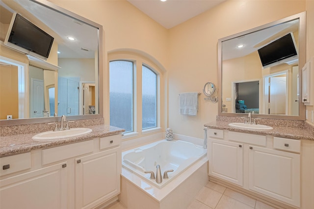 8812 Snowy Owl Loop, Missouri City, TX 77459 - full bathroom with two vanities, a tub with jets, tile patterned flooring, and a shower with door