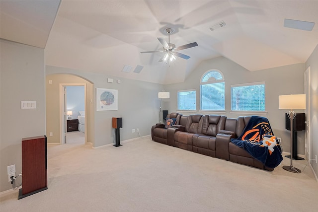 8812 Snowy Owl Loop, Missouri City, TX 77459 - carpeted living room featuring arched walkways, a ceiling fan, and lofted ceiling