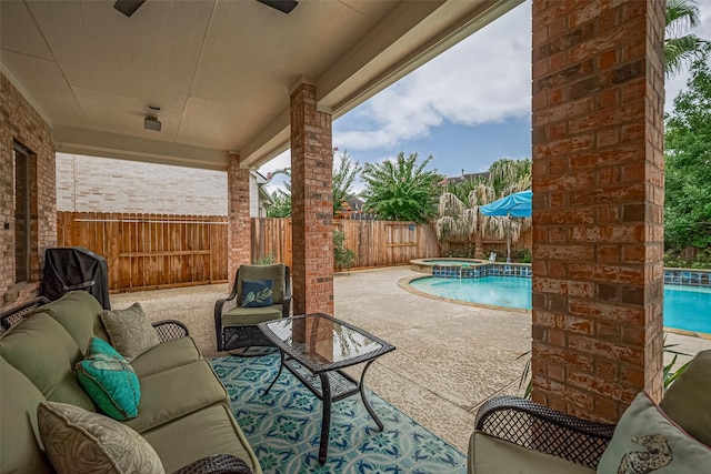 8812 Snowy Owl Loop, Missouri City, TX 77459 - fenced backyard with ceiling fan, an outdoor living space, a patio, and a pool with connected hot tub