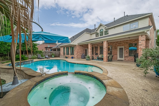 8812 Snowy Owl Loop, Missouri City, TX 77459 - view of pool with a patio and a pool with connected hot tub