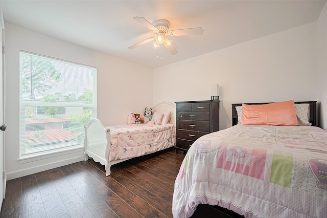 10174 Beekman Place Dr, Houston, TX 77043 - bedroom with dark wood-style flooring and a ceiling fan