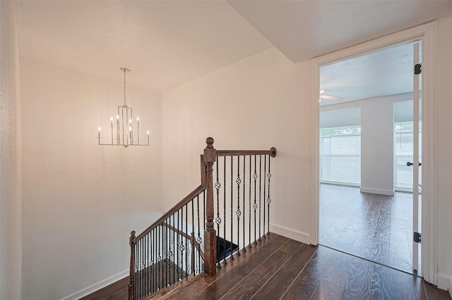 10174 Beekman Place Dr, Houston, TX 77043 - stairway with wood finished floors and a chandelier