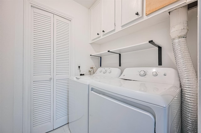 10174 Beekman Place Dr, Houston, TX 77043 - washroom with cabinet space and separate washer and dryer