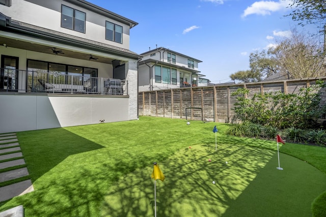 4991 Dumfries Dr, Houston, TX 77096 - view of yard featuring an area to practice putting and a ceiling fan