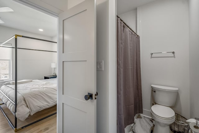 4991 Dumfries Dr, Houston, TX 77096 - full bathroom featuring ensuite bathroom, wood finished floors, and a shower with curtain