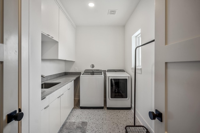 4991 Dumfries Dr, Houston, TX 77096 - washroom with independent washer and dryer, cabinet space, and recessed lighting