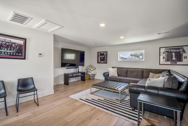 4991 Dumfries Dr, Houston, TX 77096 - living room featuring wood finished floors, recessed lighting, and attic access