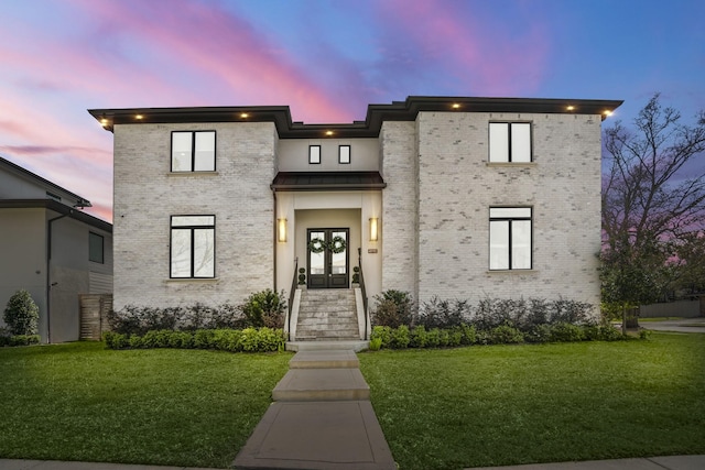 4991 Dumfries Dr, Houston, TX 77096 - contemporary home featuring french doors, a yard, and brick siding