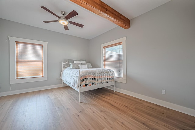 206 S Idaho St, La Porte, TX 77571 - bedroom featuring beamed ceiling, light wood-style floors, and ceiling fan