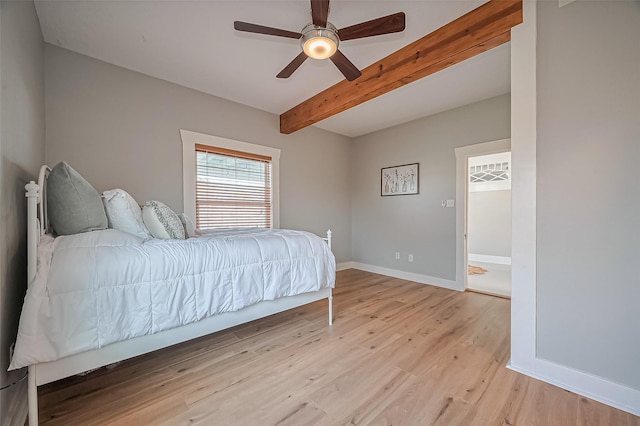 206 S Idaho St, La Porte, TX 77571 - bedroom featuring beam ceiling, light wood-style floors, and a ceiling fan