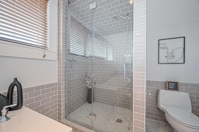 206 S Idaho St, La Porte, TX 77571 - full bathroom featuring tile walls, a shower stall, and wainscoting