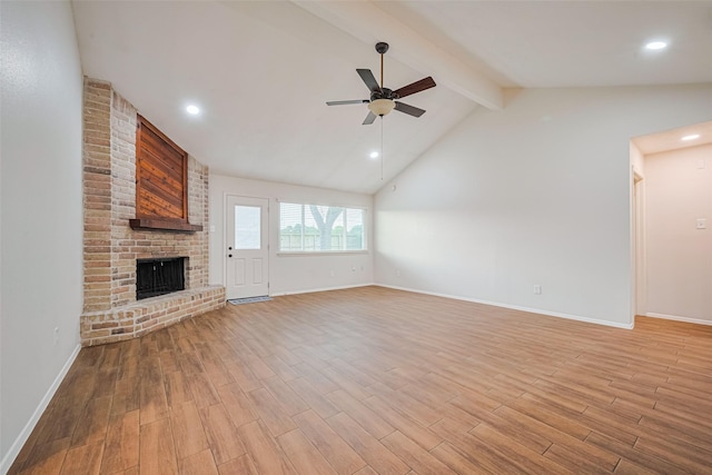 19718 Franz Rd, Houston, TX 77084 - unfurnished living room with ceiling fan, a fireplace, light wood-style flooring, and recessed lighting