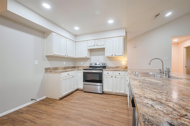 19718 Franz Rd, Houston, TX 77084 - kitchen featuring stainless steel appliances, light wood finished floors, white cabinets, light countertops, and recessed lighting