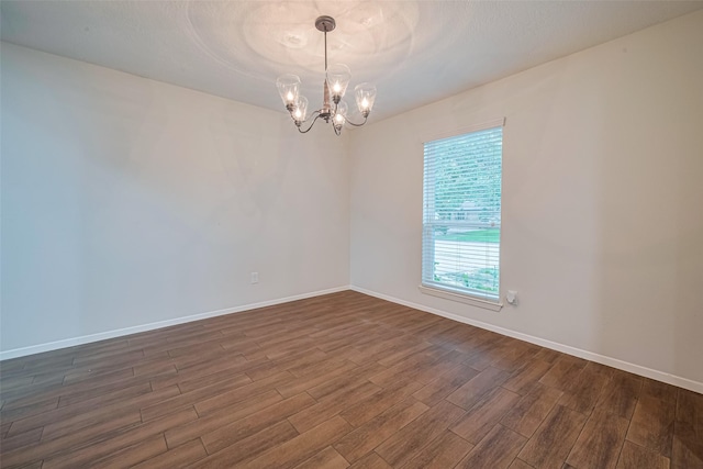 19718 Franz Rd, Houston, TX 77084 - empty room with dark wood-style flooring and a chandelier