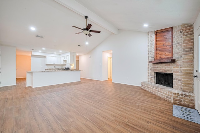 19718 Franz Rd, Houston, TX 77084 - unfurnished living room featuring a ceiling fan, light wood-style floors, a fireplace, and recessed lighting