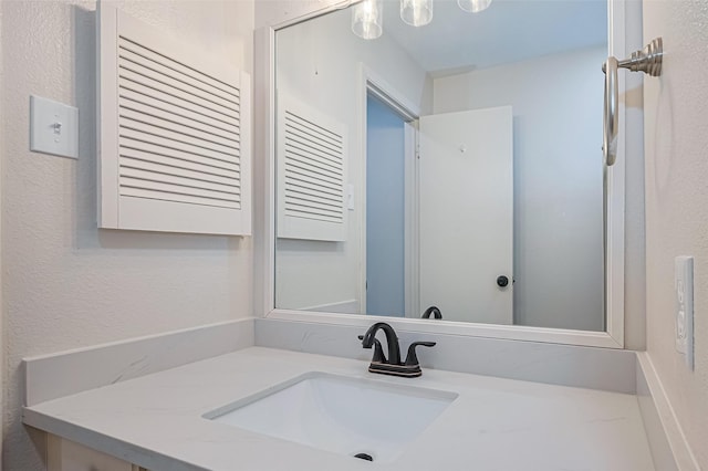 19718 Franz Rd, Houston, TX 77084 - bathroom featuring vanity and a textured wall