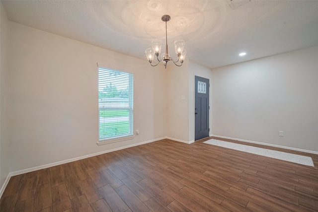 19718 Franz Rd, Houston, TX 77084 - spare room with dark wood-type flooring, a chandelier, and recessed lighting