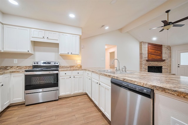 19718 Franz Rd, Houston, TX 77084 - kitchen with stainless steel appliances, light wood-style flooring, a ceiling fan, white cabinetry, and recessed lighting