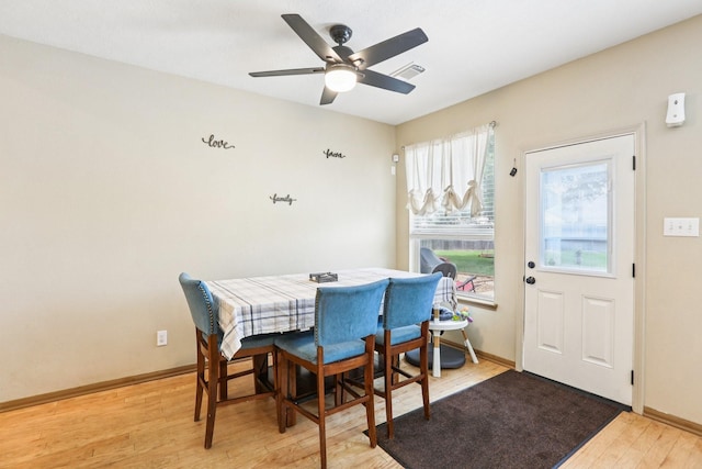 3211 Waterglen Ct, League City, TX 77573 - dining room featuring light wood finished floors and a ceiling fan