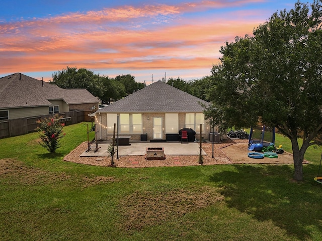 3211 Waterglen Ct, League City, TX 77573 - back of house with a patio area, a fire pit, a shingled roof, and brick siding