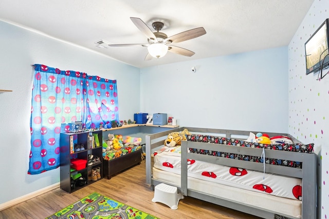 3211 Waterglen Ct, League City, TX 77573 - bedroom with wood finished floors and ceiling fan
